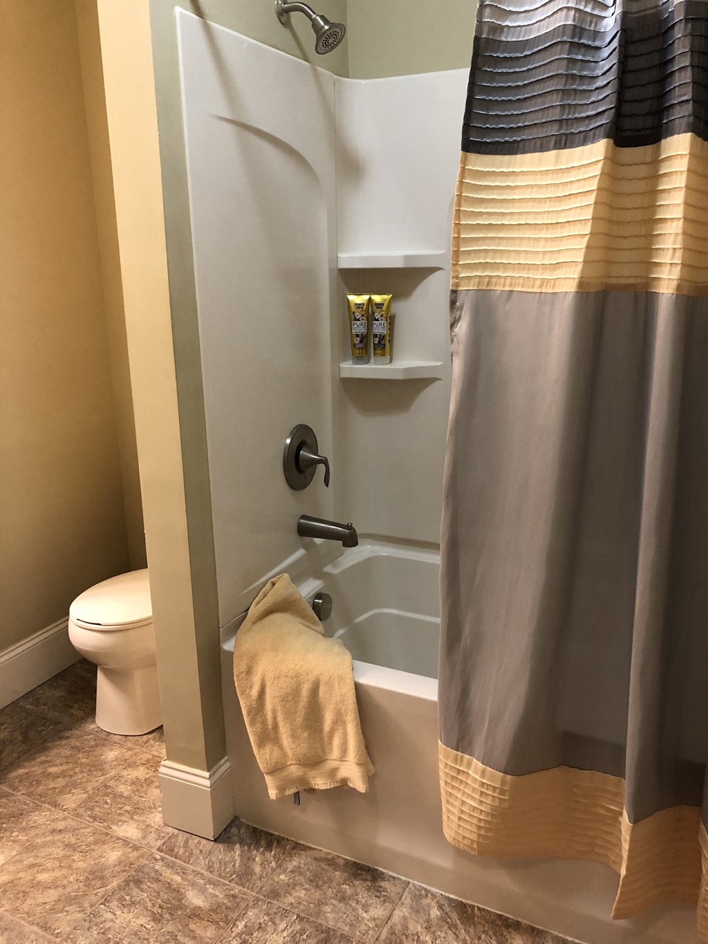 a small bathroom with a shower and a toilet