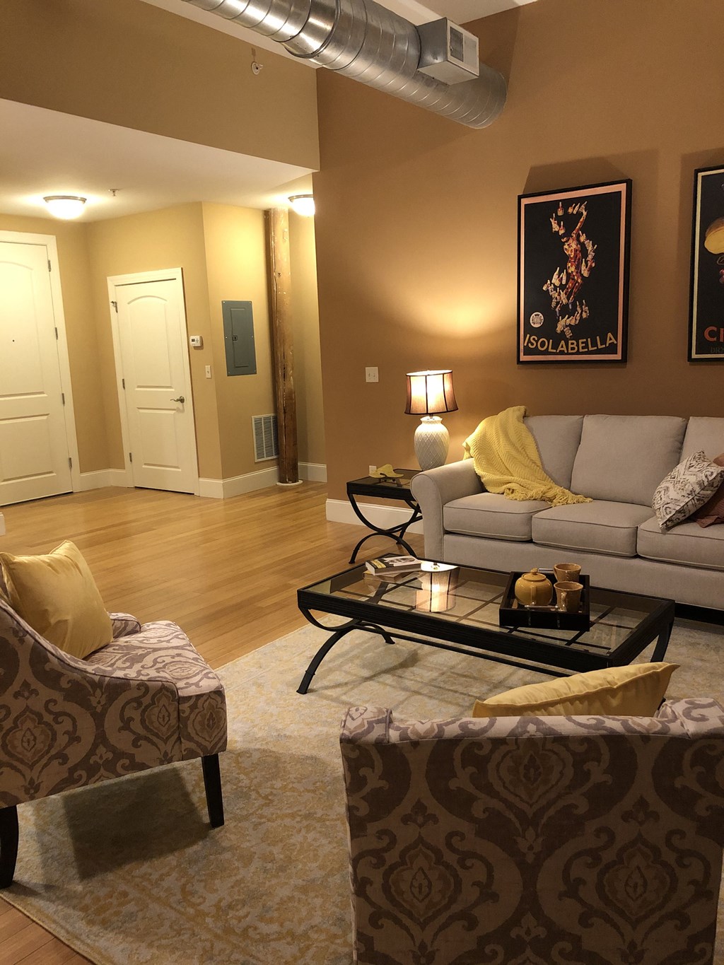 a living room with couches and chairs and a table