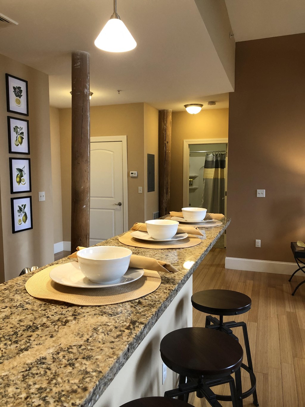 a long counter with plates and bowls on it in a kitchen