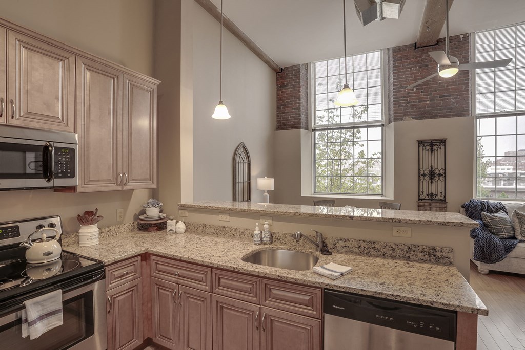 a kitchen with a sink and a counter top