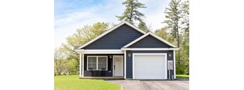 A two-car garage with a white door and a small porch.
