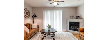 A living room with a fireplace and a couch.
