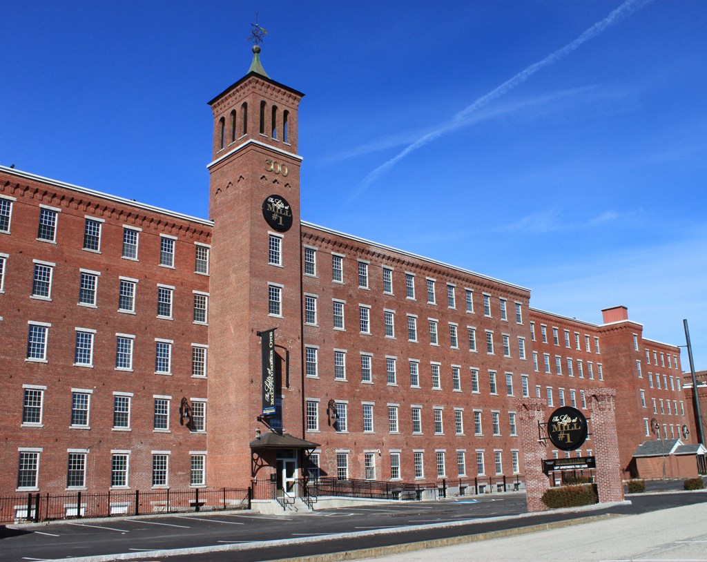 a large brick building with a clock tower