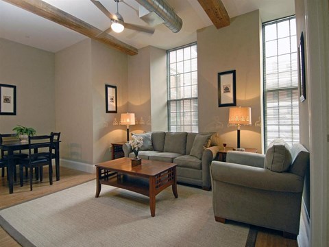 a living room with couches and a coffee table