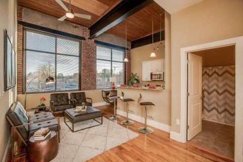 a living room with a couch and a bar