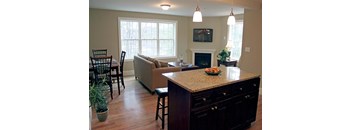 A kitchen with a counter and a couch.