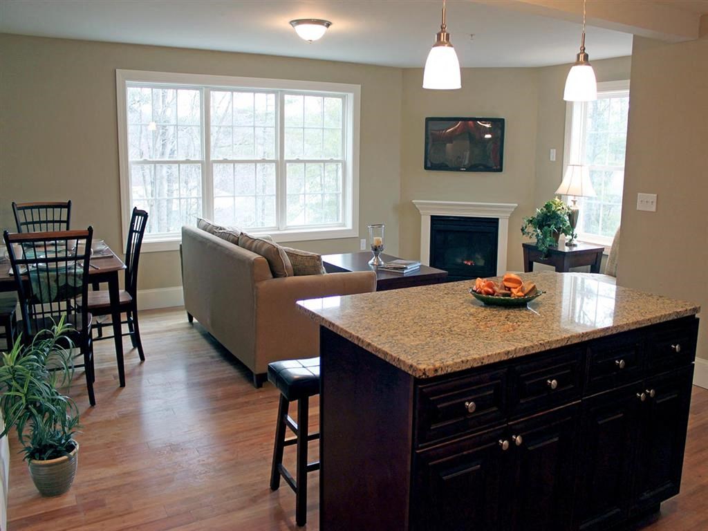 a kitchen and living room with a counter top