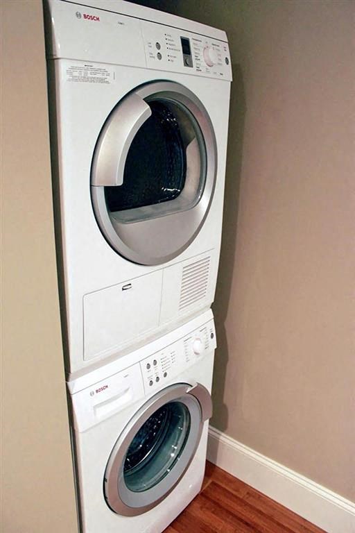 a washing machine and a dryer in a room