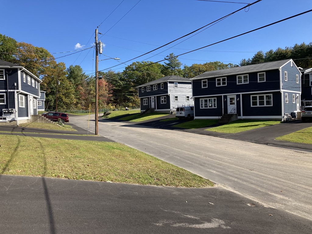 a row of houses on the side of a street