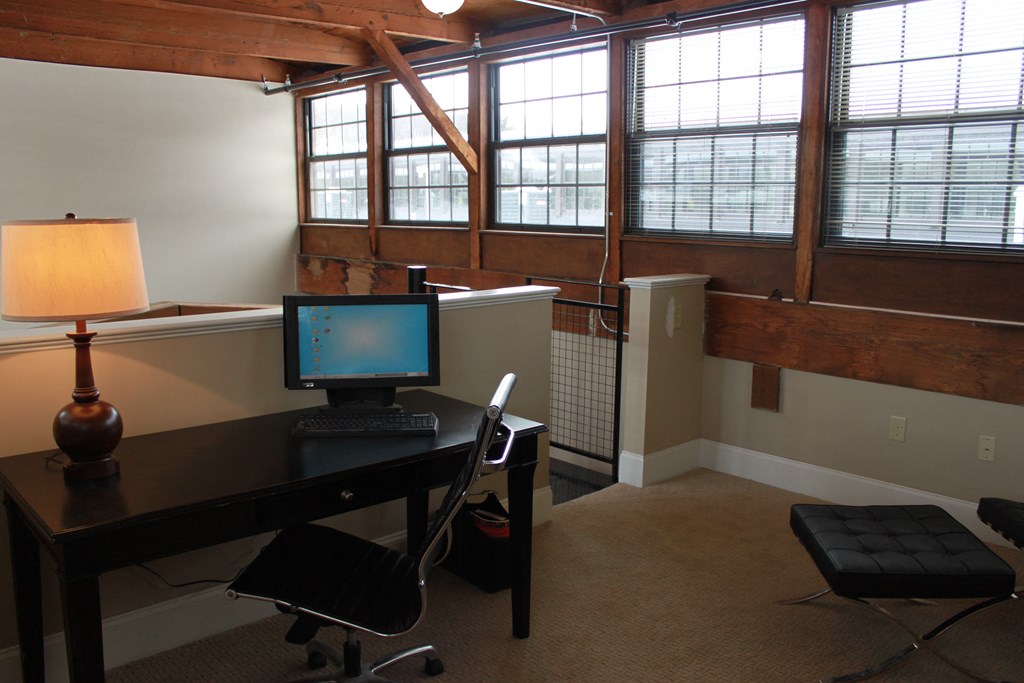 a home office with a desk and a computer