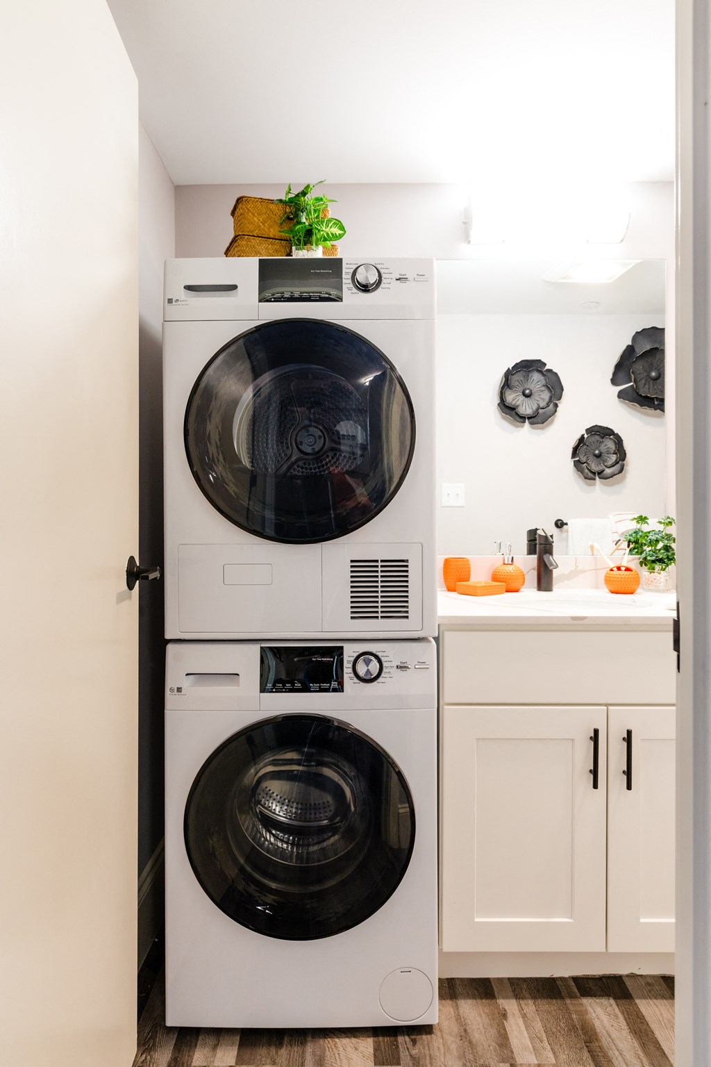 a small laundry room with a washer and dryer and a sink