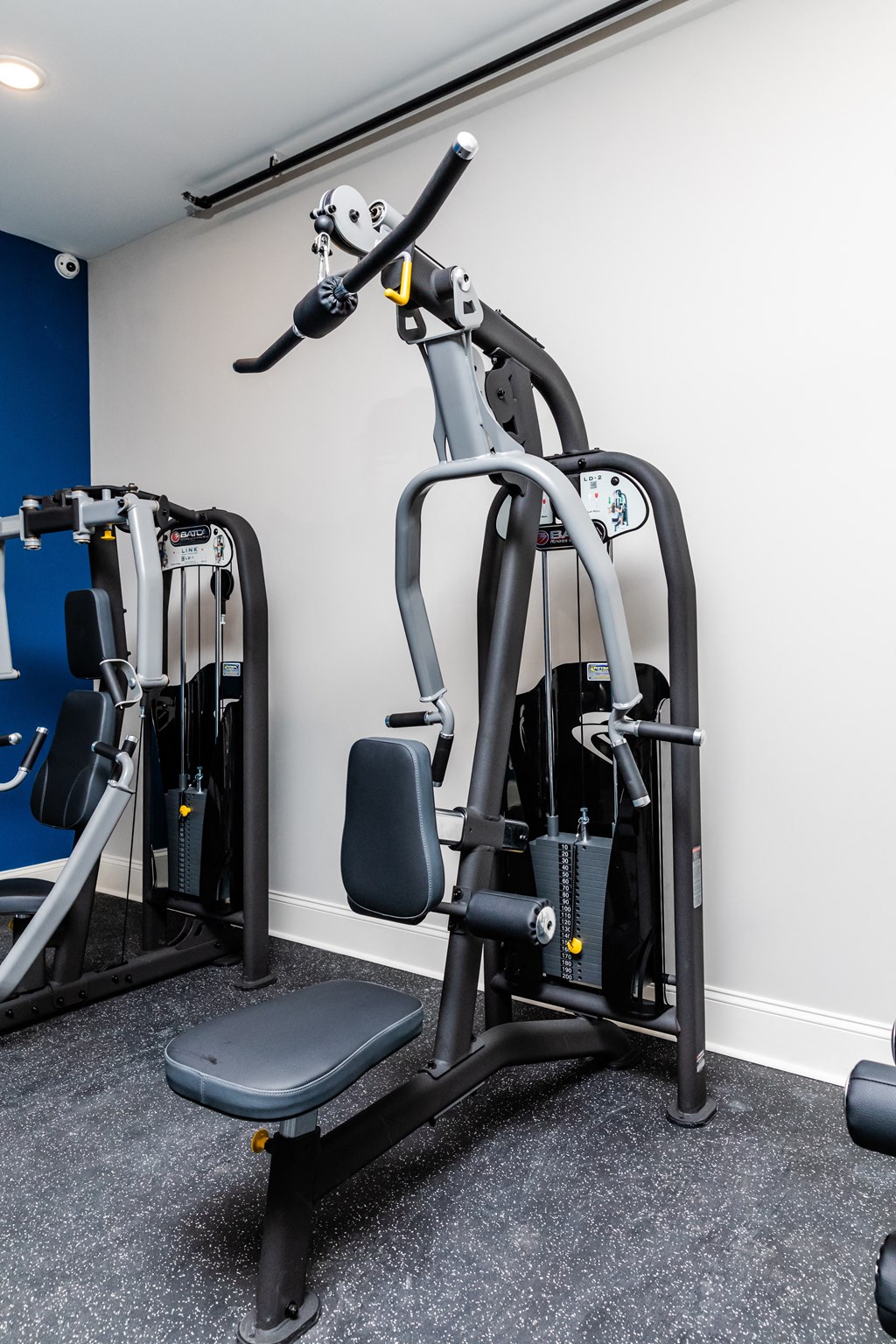 a gym with treadmills and other exercise equipment in a room