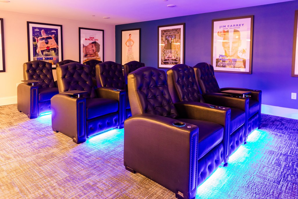 a room with blue chairs and purple lights