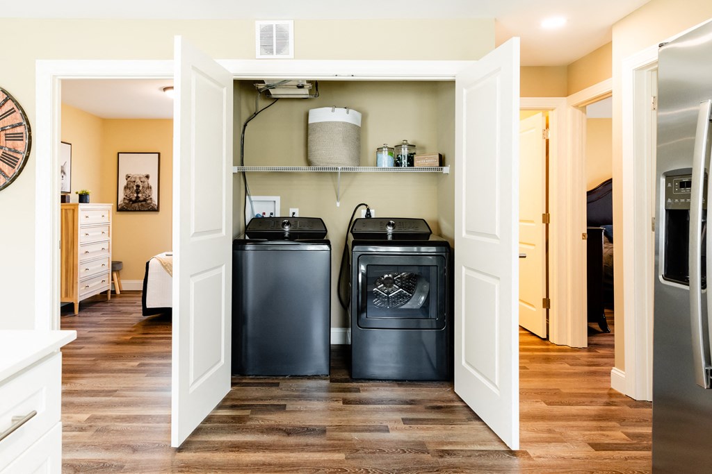 a laundry room with two washes and a dryer in it