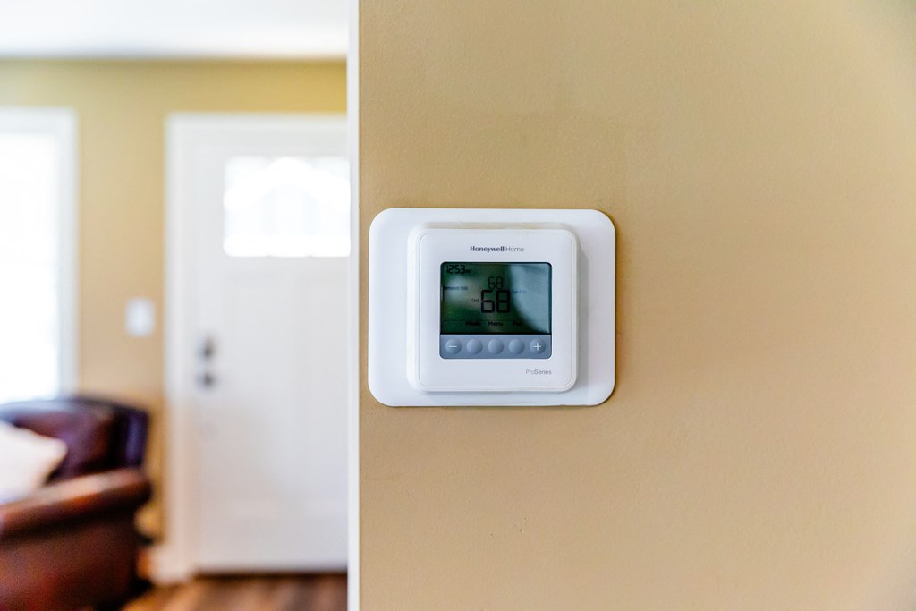 an image of a thermostat on a wall in a living room