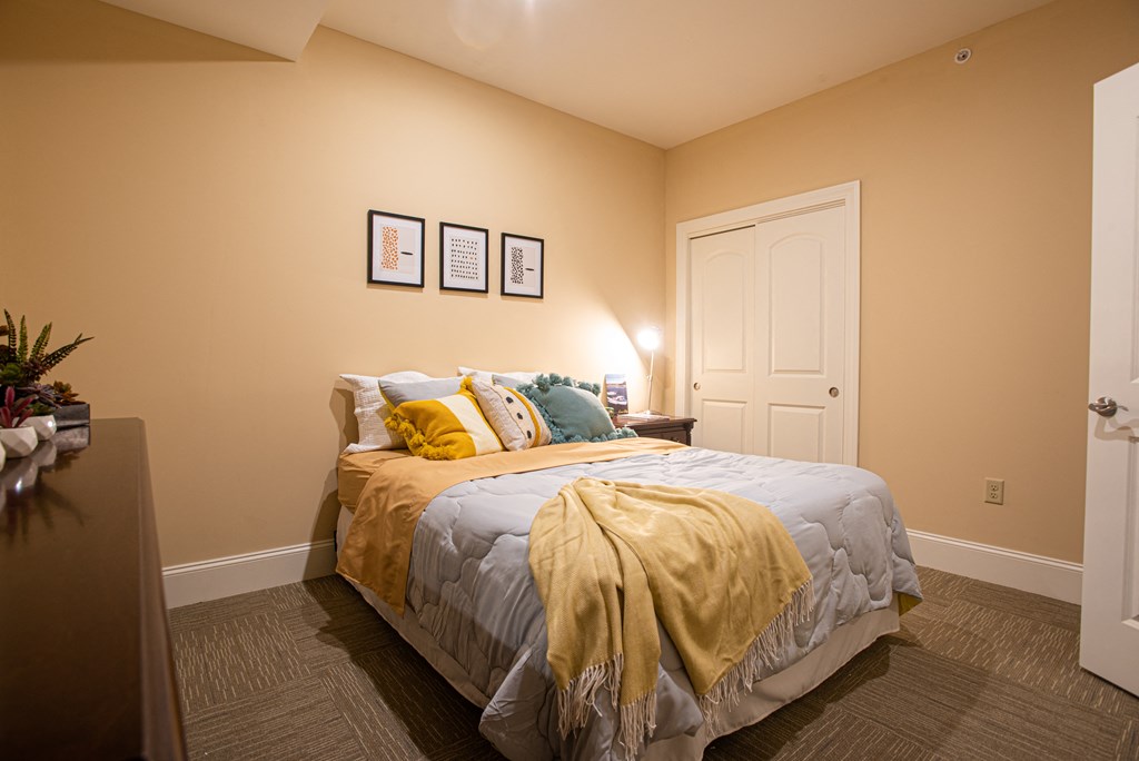 a bedroom with a bed and a door