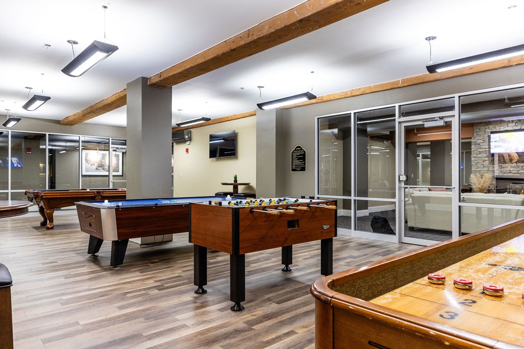 A pool table with a green cloth and a billiard ball on it.