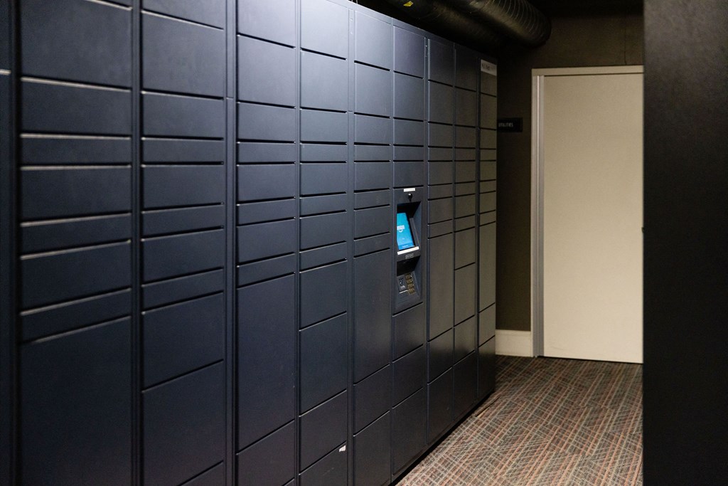 A wall of lockers with a door on the right.