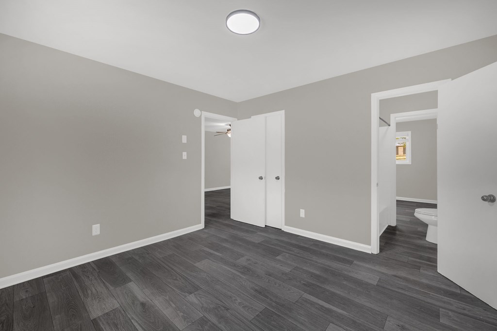 A room with a grey floor and white walls.
