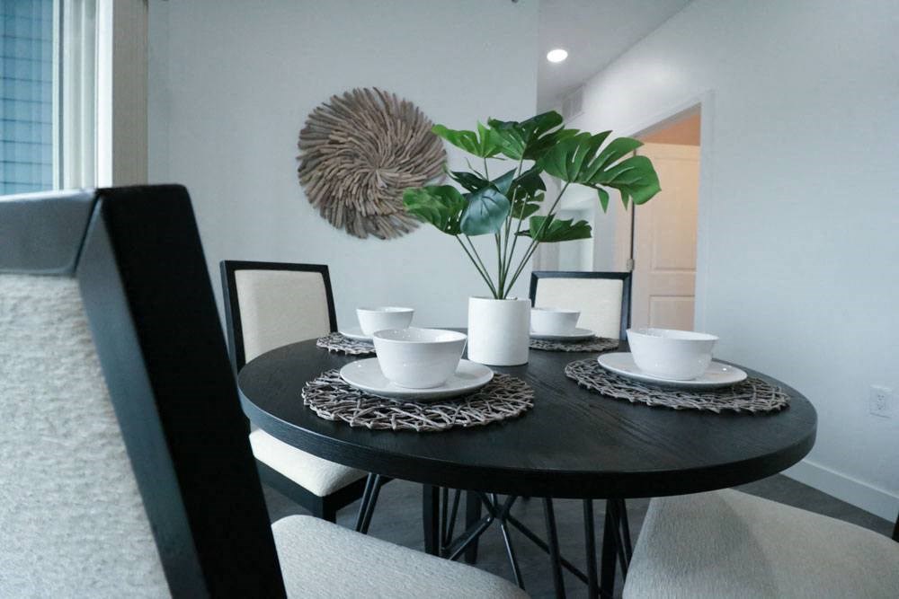 a dining room with a table and chairs