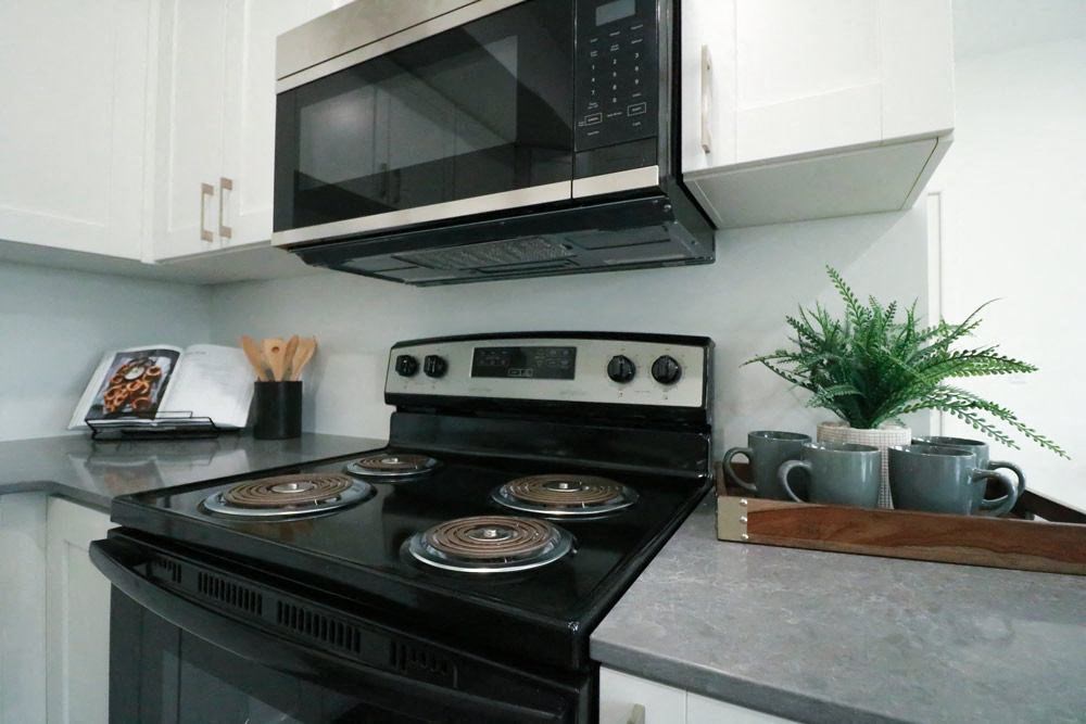 a kitchen with a stove and a microwave