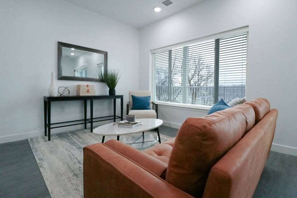 a living room with a couch and a table