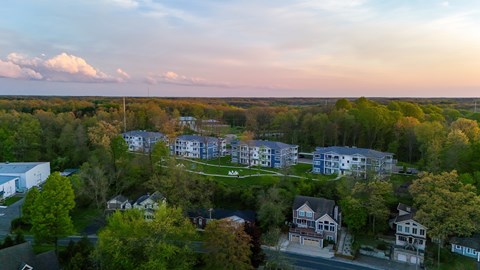 A bird's eye view of a residential area with houses and trees.