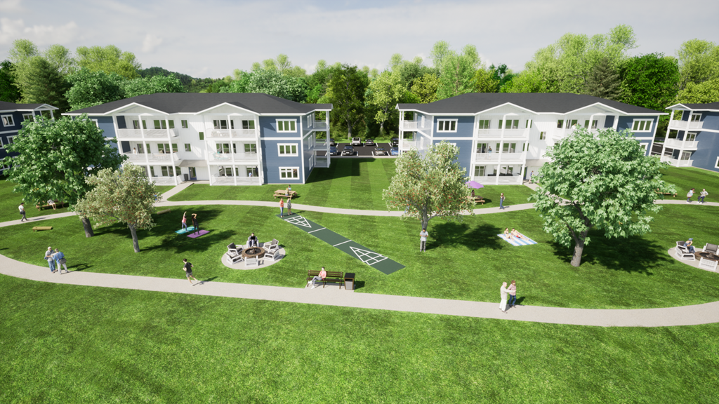 an aerial view of a park with trees and buildings in the background
