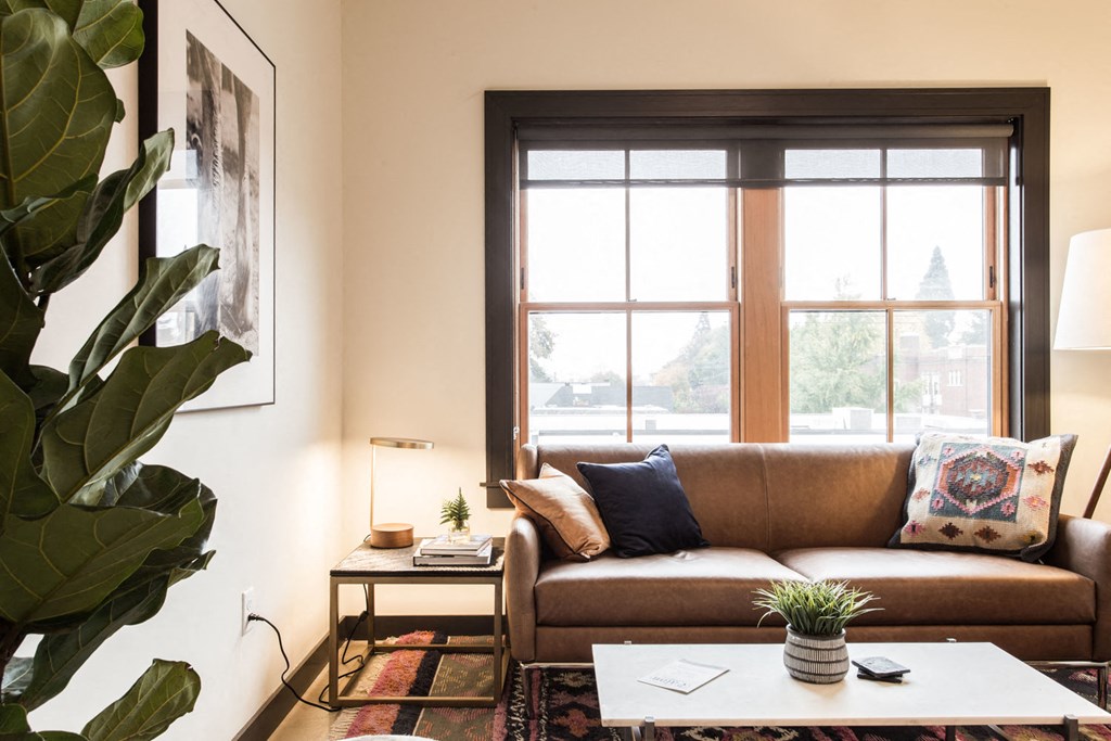 a living room with a couch and a window