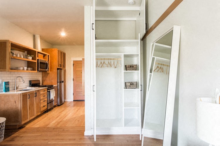 a kitchen with a mirror and a sliding glass door