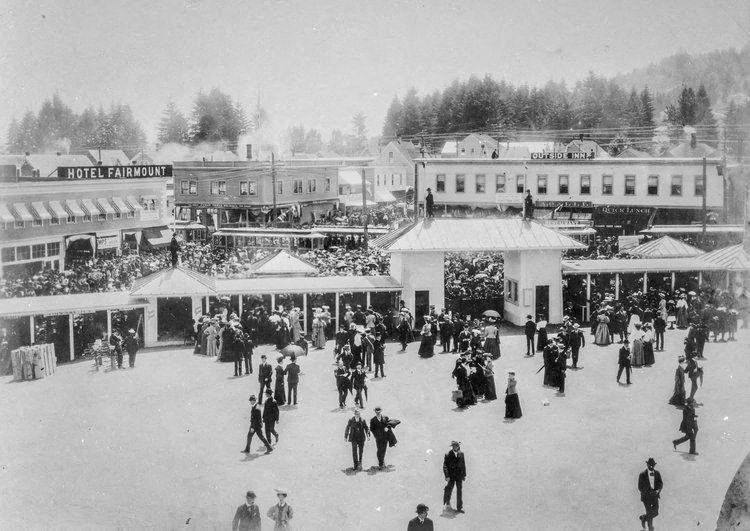 a black and white photo of a crowd of people in the snow