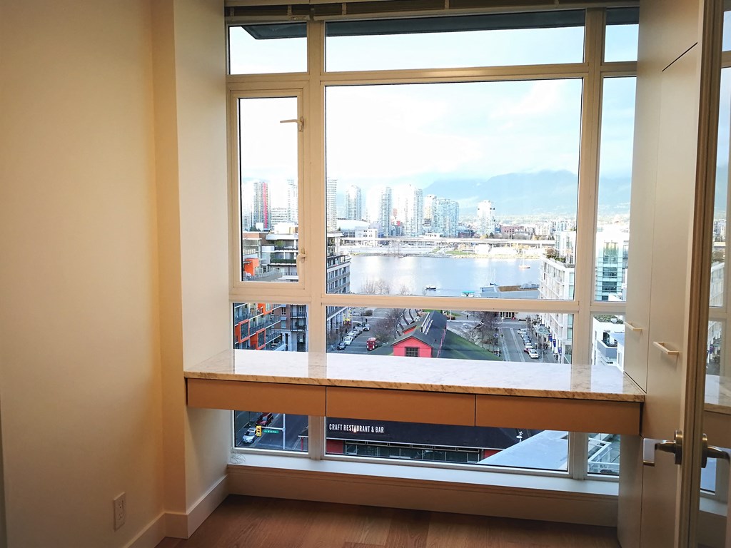 a view of the city from a window in a room