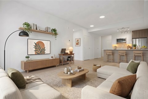 A living room with a white couch, a wooden coffee table, and a painting on the wall.