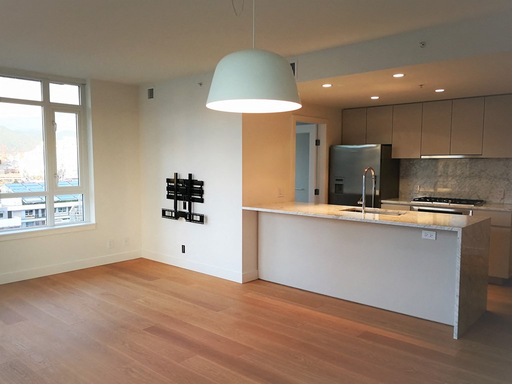 a view of the kitchen and dining area from the living room