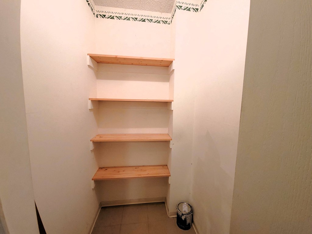 a walk in closet in the garage