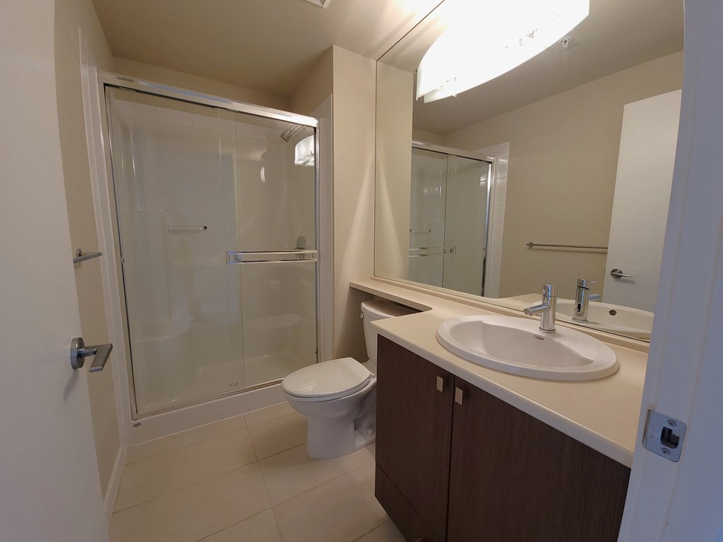 a bathroom with a sink toilet and a shower