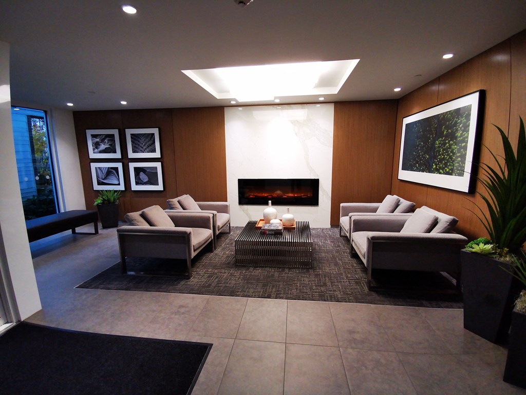a living room with couches and a fireplace