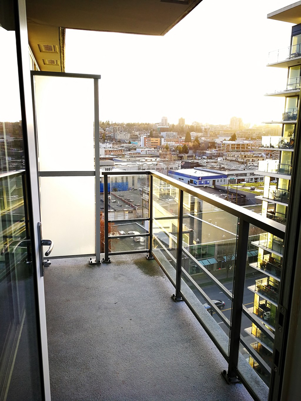 a balcony with a view of a city in the distance
