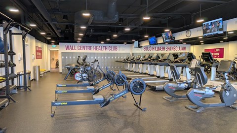 A gym with treadmills and exercise equipment.