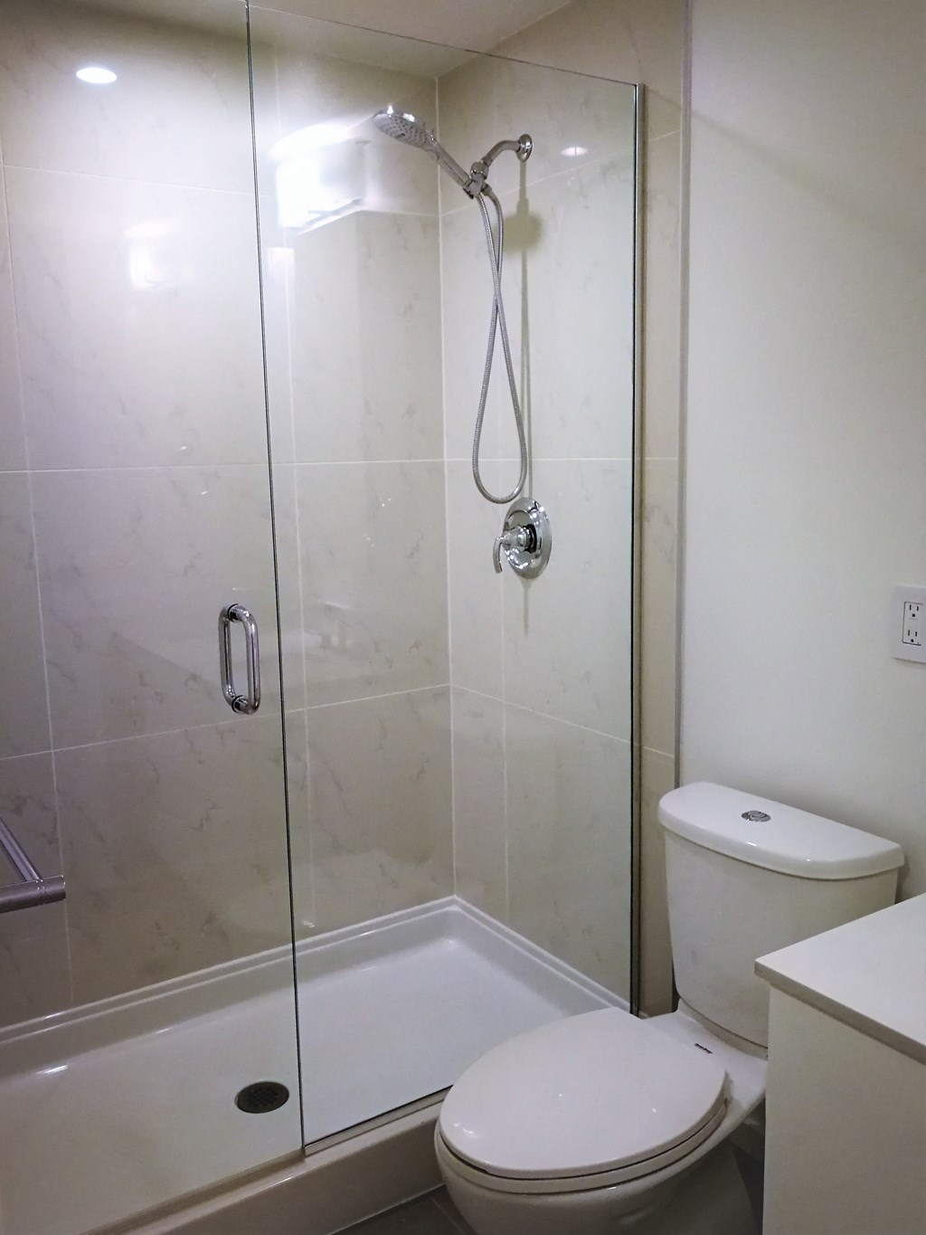 a small bathroom with a shower and a toilet