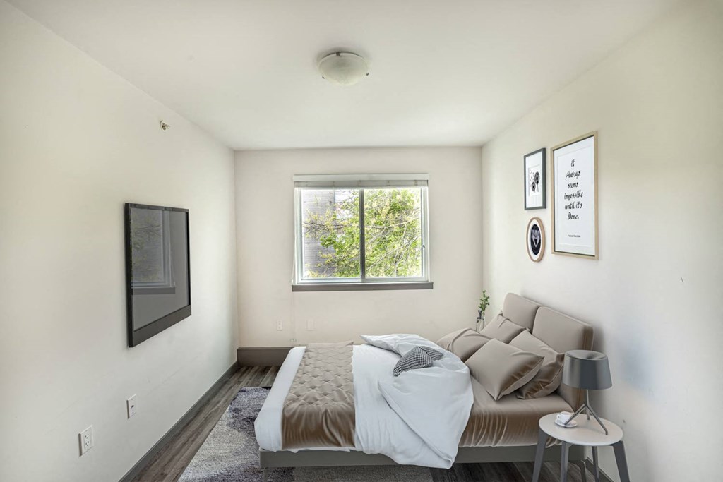 a bedroom with a bed and a window