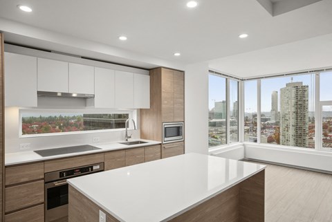 A modern kitchen with a large island in the middle.