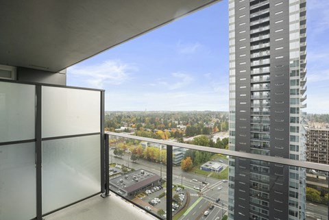 A view from a high-rise building looking out over a cityscape.