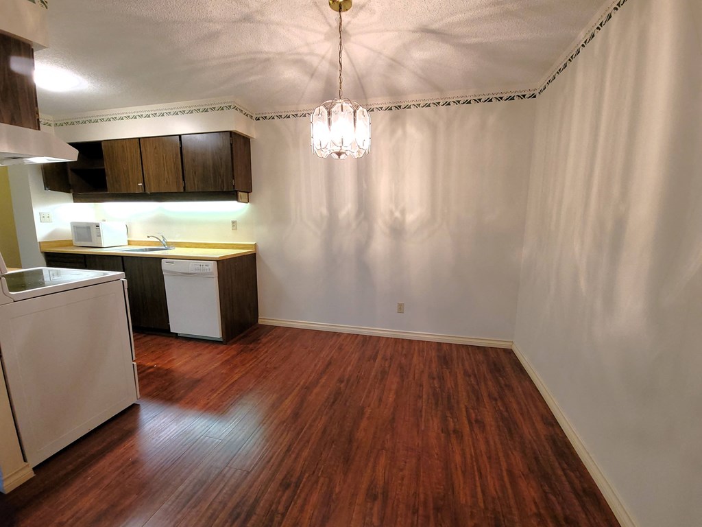 a kitchen and dining area in a 555 waverly unit
