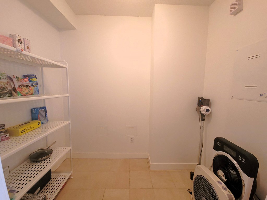 a laundry room with a washer and dryer in it