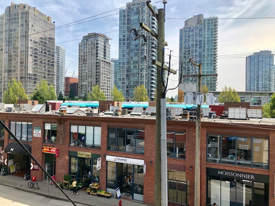a view of a building with a city in the background