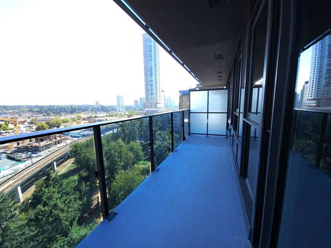 a balcony with a view of a city