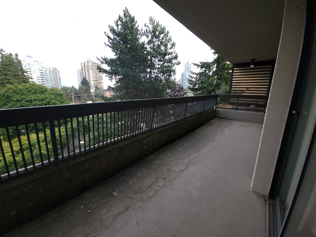 a large balcony with a view of the city