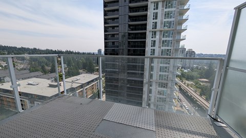 A view from a high-rise building looking down at a cityscape.
