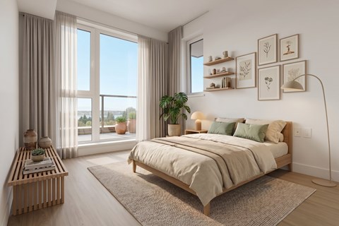 A bedroom with a large bed and a view of the outdoors through the window.